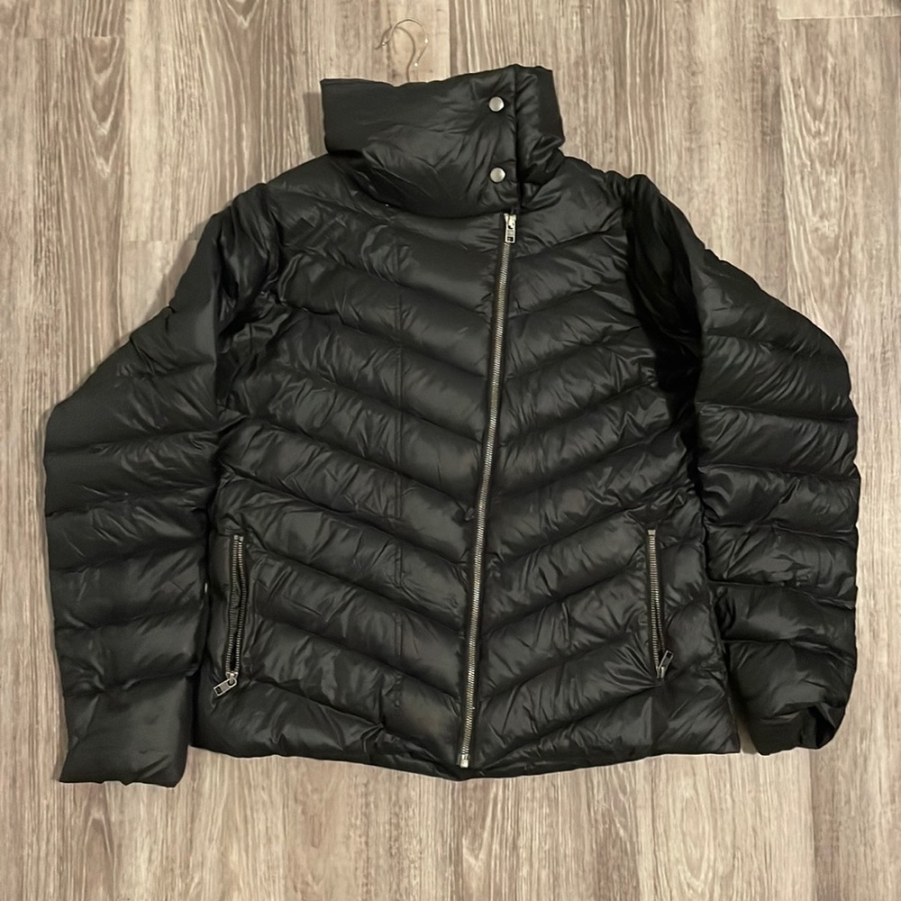 Patagonia down winter jacket. Black with an asymmetrical zipper down the front.